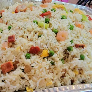 Small party trays of rice and noodles run about $36 (as of 2022) Yang chao fried rice. Delicious.