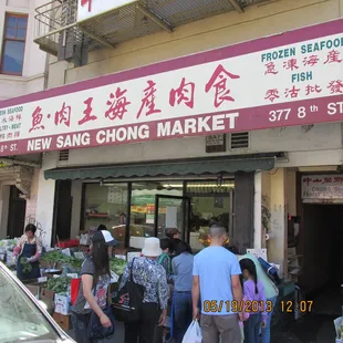 people standing outside of the store
