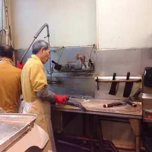 two men working in a kitchen