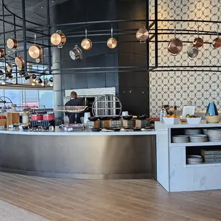 stainless steel counter with pots and pans