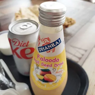 a bottle of diet coke and a can of diet coke