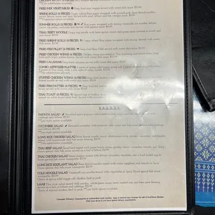 a menu in a black folder