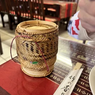 a bowl of soup and a knife on a table