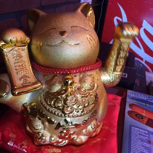 This little guy greets you when you walk in and waves by when you leave.