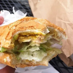 Santa Fe chicken sandwich on a toasted, flaky soft roll bread Chicken, lettuce, tomato, pickles, onion, jalapeños mustard &amp; mayo