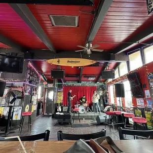 Bright and beachy vibes. Fun place to see a band. Up one flight of stairs.