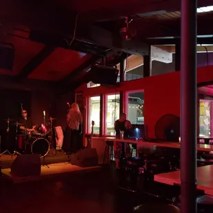 a band playing in a dimly lit room