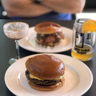 two burgers and a glass of beer