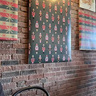 Festive wall decor cover ups. The small eatery was decked out in festive colors for Christmas.