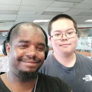 two men with headphones on