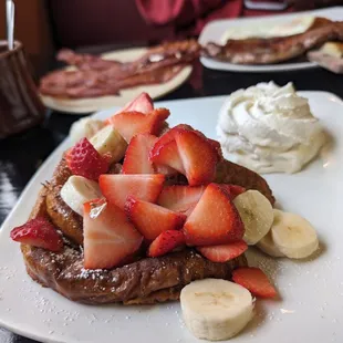 Phenomenal French toast  with whipped cream on the side