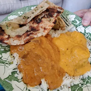 Garlic Naan, lamb korma and malai kofta with a half eaten samosa!