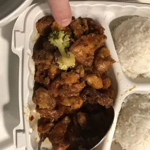 General Tso Chicken - includes steamed broccoli - and there&apos;s exactly one puny sad piece of broccoli  - and no shortage of rice.