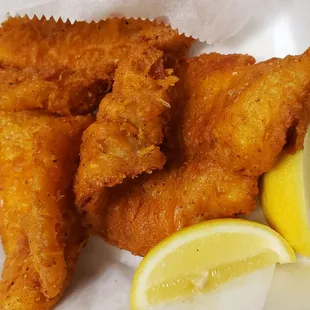 a close up of a plate of fried chicken