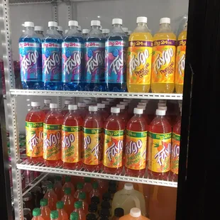 a refrigerator full of soft drinks