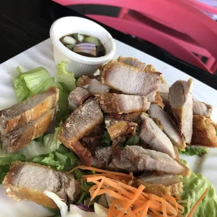 Real life (very dried) pork belly compared to picture in their menu