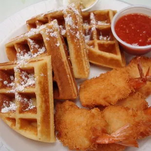 a plate of waffles and shrimp