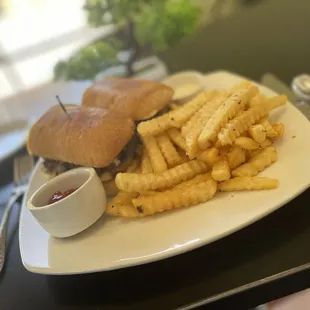 Blue Cheese Steak sandwich with a side of fries.