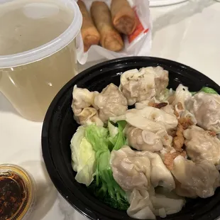 Order of fried egg rolls (3) and shrimp/pork wonton on chicken broth (to-go order).