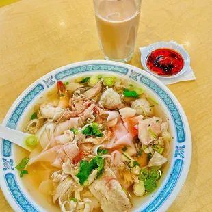 a bowl of soup and a drink