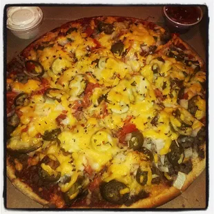 a pizza with cheese and vegetables