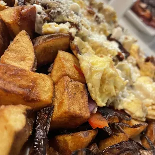 Artichoke hearts and goat cheese scramble with burn onions and bland potatoes :(