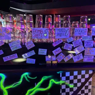 a bar with neon signs