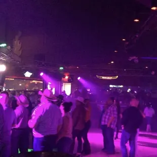a group of people dancing at a party