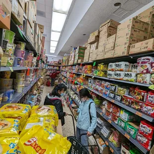 two people shopping in a grocery store
