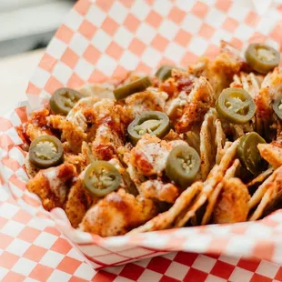 a basket of chicken and olives