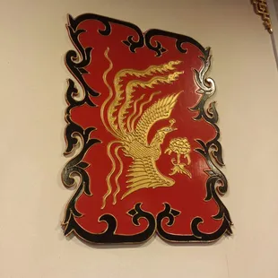 a red and gold dragon on the wall