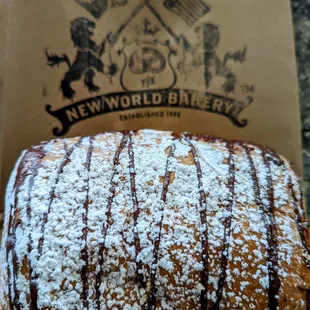 a pastry with powdered sugar on top