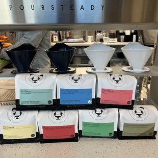 Selection of Black &amp; White Roasters Coffee Ready for the Poursteady