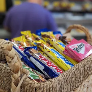Candy basket by the register and the owner in the background