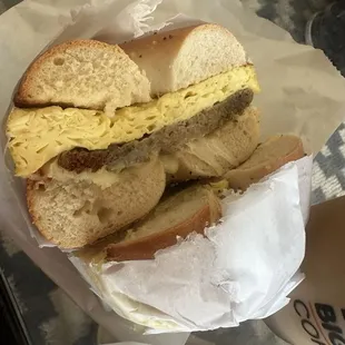 Salt bagel with egg and sausage