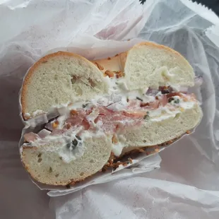 Lox on garlic bagel with plain cream cheese, capers and onions