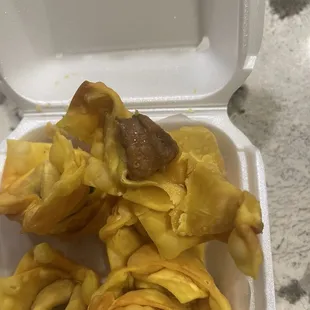 Nasty-looking filling inside of fried wontons.