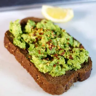 a slice of bread with avocado on it