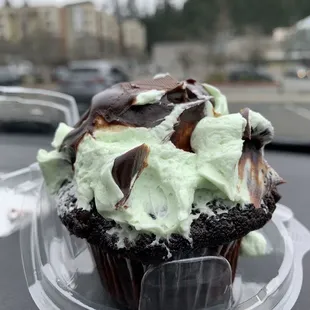 a cupcake in a plastic container