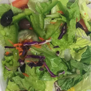 delicious greek salad, crispy lettuce and sauce came in a container