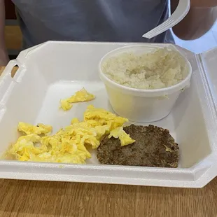 Scrambled eggs with Turkey sausage and grits.
