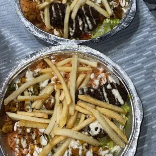 two trays of food on a table