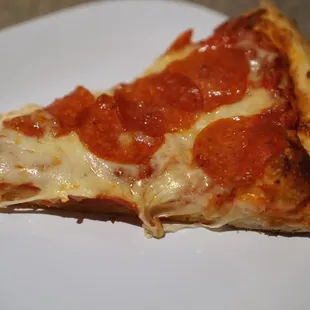 a slice of pepperoni pizza