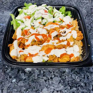Grilled Chicken over rice and salad.