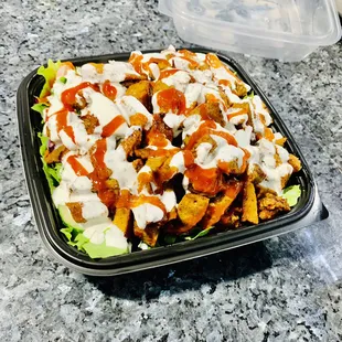 Grilled Lamb over rice and salad.