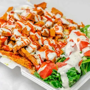 Grilled Lamb over rice and salad