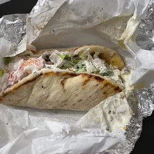 The gyro is the length of a small burrito.
