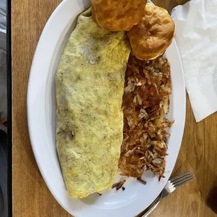 Traditional Cheese Omelette + double jalapenos + tomatoes + onions+ ham+bacon + sausage. Crispy hash browns. Biscuits.