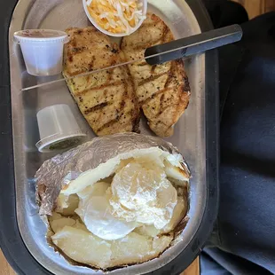 Juicy Pork chops and a huge bake potato.  Very flavorful.
