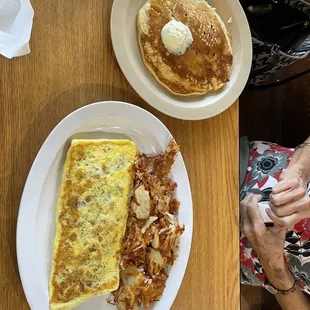 Traditional Cheese Omelette with tomatoes and ham. Two regular pancakes Hash browns are the best-actually browned and crispy!